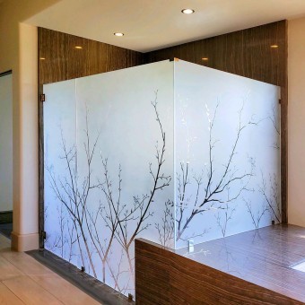 Large etched glass shower with tree motif for custom home