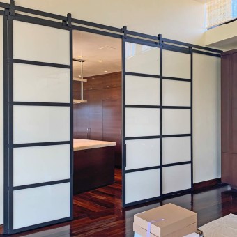 I created these large metal and glass barn doors to give optional privacy between a large kitchen and a living room in a custom home in San Diego.